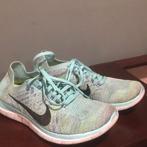 Nike teal flyknit sneakers - size 8